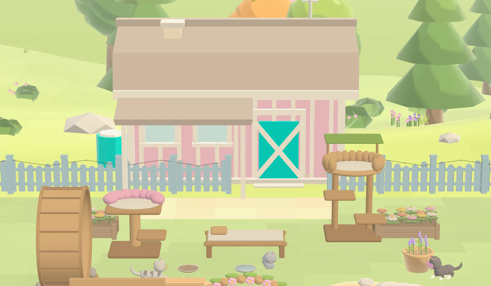 The sanctuary yard by day, with a pink barn, a picket fence and cat furniture